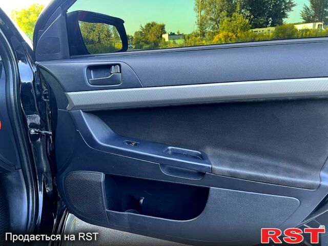 Черный Мицубиси Лансер, объемом двигателя 2 л и пробегом 216 тыс. км за 7500 $, фото 4 на Automoto.ua