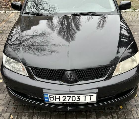 Черный Мицубиси Лансер, объемом двигателя 1.6 л и пробегом 300 тыс. км за 3400 $, фото 5 на Automoto.ua