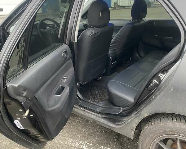 Черный Мицубиси Лансер, объемом двигателя 1.58 л и пробегом 263 тыс. км за 4000 $, фото 29 на Automoto.ua