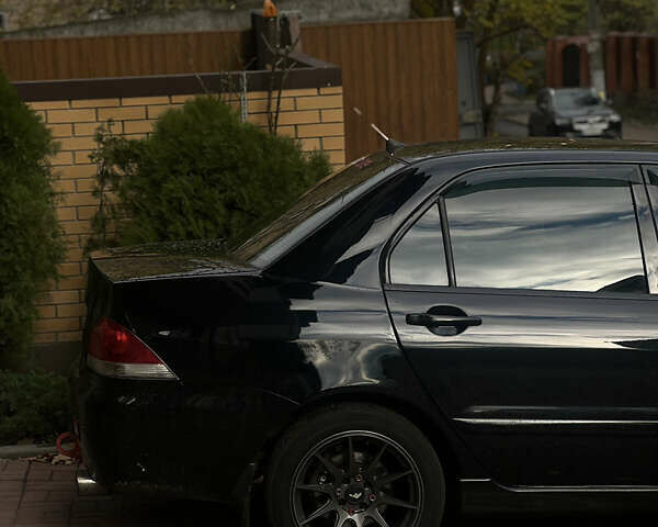 Черный Мицубиси Лансер, объемом двигателя 1.6 л и пробегом 211 тыс. км за 5700 $, фото 21 на Automoto.ua