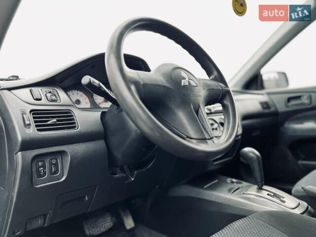 Чорний Міцубісі Lancer, об'ємом двигуна 1.6 л та пробігом 243 тис. км за 4950 $, фото 36 на Automoto.ua