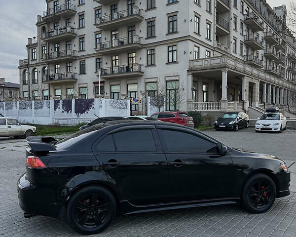 Черный Мицубиси Лансер, объемом двигателя 2 л и пробегом 245 тыс. км за 6200 $, фото 9 на Automoto.ua