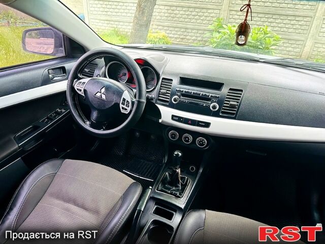 Черный Мицубиси Лансер, объемом двигателя 2 л и пробегом 195 тыс. км за 5500 $, фото 6 на Automoto.ua