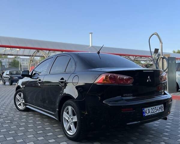 Чорний Міцубісі Lancer, об'ємом двигуна 2 л та пробігом 188 тис. км за 6900 $, фото 11 на Automoto.ua