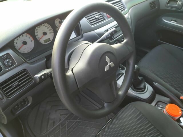 Черный Мицубиси Лансер, объемом двигателя 1.6 л и пробегом 32 тыс. км за 9000 $, фото 19 на Automoto.ua