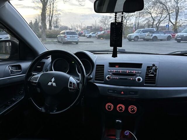 Черный Мицубиси Лансер, объемом двигателя 2 л и пробегом 242 тыс. км за 6200 $, фото 14 на Automoto.ua