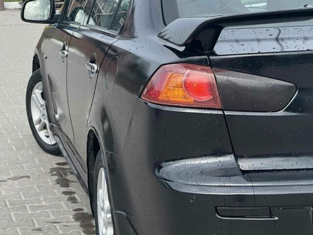 Черный Мицубиси Лансер, объемом двигателя 2 л и пробегом 350 тыс. км за 4299 $, фото 5 на Automoto.ua