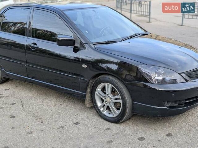 Чорний Міцубісі Lancer, об'ємом двигуна 2 л та пробігом 152 тис. км за 5500 $, фото 2 на Automoto.ua