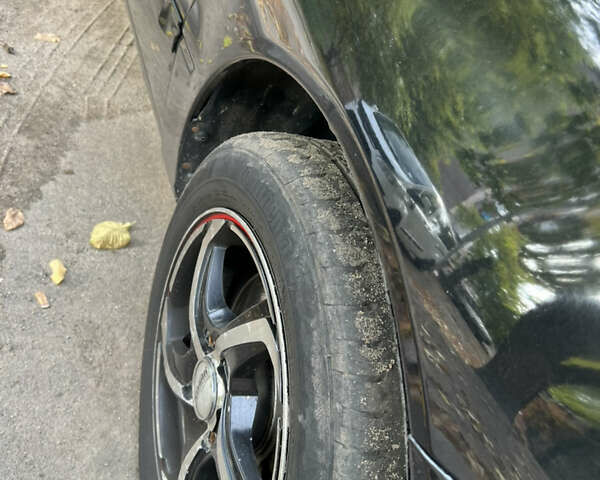 Чорний Міцубісі Lancer, об'ємом двигуна 1.58 л та пробігом 234 тис. км за 3800 $, фото 6 на Automoto.ua