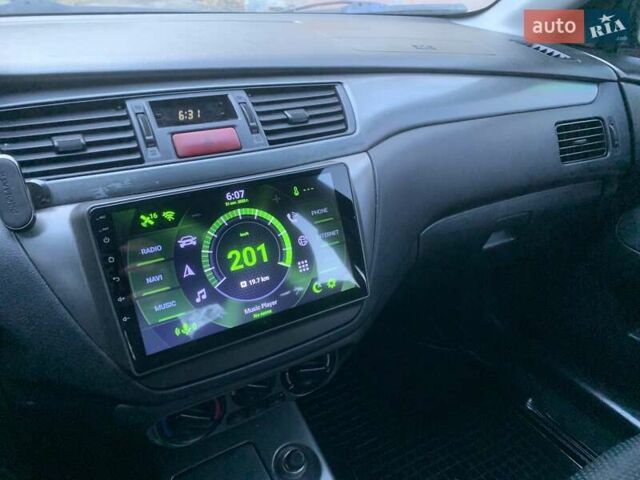 Чорний Міцубісі Lancer, об'ємом двигуна 1.58 л та пробігом 237 тис. км за 4300 $, фото 10 на Automoto.ua