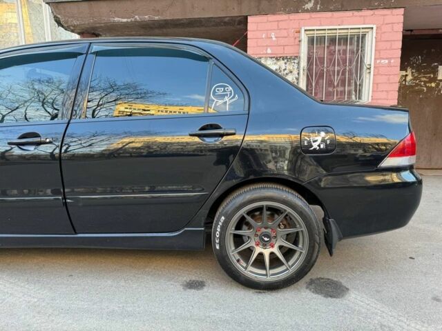 Черный Мицубиси Лансер, объемом двигателя 1.6 л и пробегом 211 тыс. км за 5600 $, фото 2 на Automoto.ua