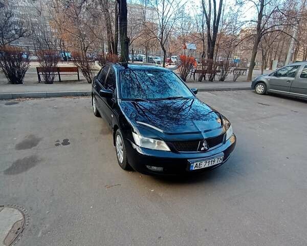 Чорний Міцубісі Lancer, об'ємом двигуна 1.6 л та пробігом 296 тис. км за 4500 $, фото 4 на Automoto.ua