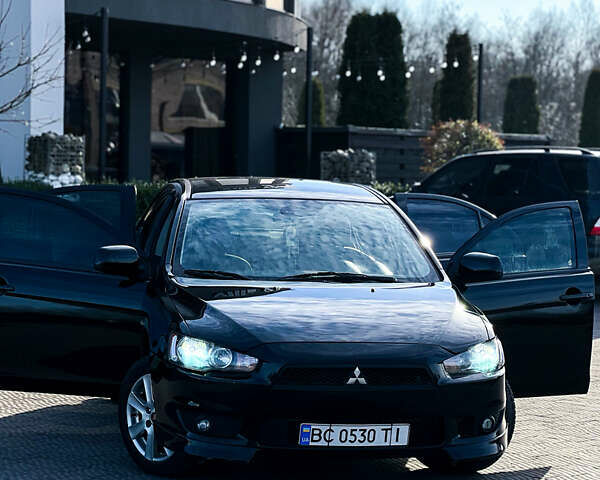 Черный Мицубиси Лансер, объемом двигателя 2 л и пробегом 333 тыс. км за 7300 $, фото 2 на Automoto.ua