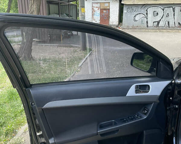 Чорний Міцубісі Lancer, об'ємом двигуна 2 л та пробігом 271 тис. км за 5700 $, фото 13 на Automoto.ua