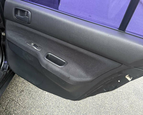 Чорний Міцубісі Lancer, об'ємом двигуна 1.58 л та пробігом 256 тис. км за 3700 $, фото 22 на Automoto.ua