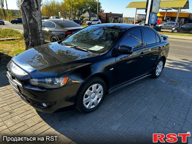 Черный Мицубиси Лансер, объемом двигателя 2 л и пробегом 250 тыс. км за 5900 $, фото 4 на Automoto.ua