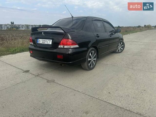 Чорний Міцубісі Lancer, об'ємом двигуна 1.6 л та пробігом 310 тис. км за 5100 $, фото 16 на Automoto.ua