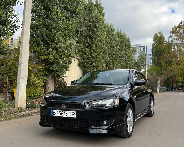 Черный Мицубиси Лансер, объемом двигателя 2 л и пробегом 219 тыс. км за 6400 $, фото 1 на Automoto.ua