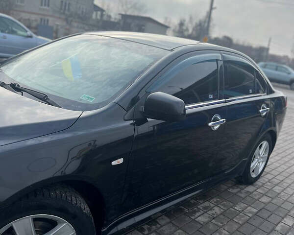 Чорний Міцубісі Lancer, об'ємом двигуна 2 л та пробігом 188 тис. км за 6600 $, фото 1 на Automoto.ua