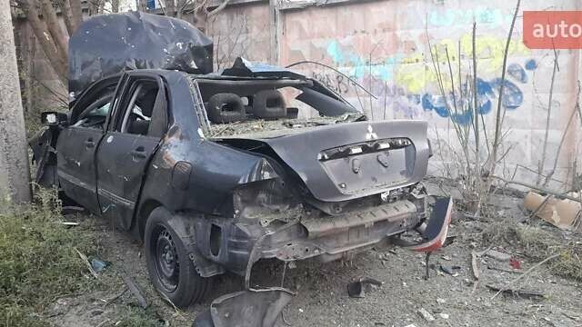 Черный Мицубиси Лансер, объемом двигателя 1.58 л и пробегом 220 тыс. км за 999 $, фото 1 на Automoto.ua