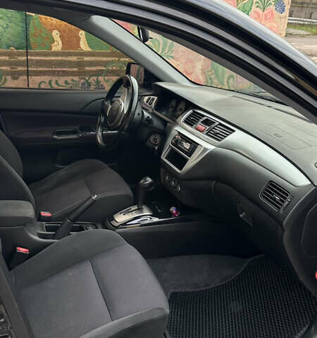 Черный Мицубиси Лансер, объемом двигателя 2 л и пробегом 143 тыс. км за 4999 $, фото 5 на Automoto.ua