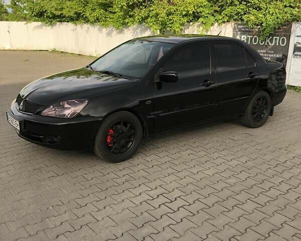 Чорний Міцубісі Lancer, об'ємом двигуна 1.59 л та пробігом 179 тис. км за 4980 $, фото 4 на Automoto.ua