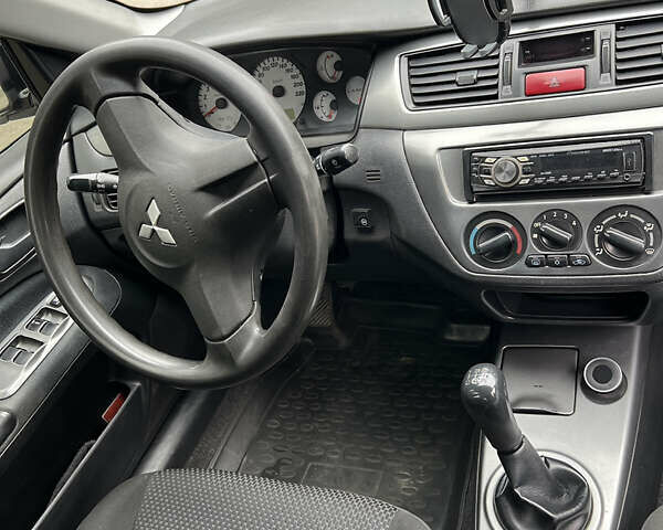 Чорний Міцубісі Lancer, об'ємом двигуна 1.58 л та пробігом 256 тис. км за 4200 $, фото 13 на Automoto.ua