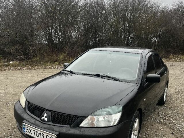 Черный Мицубиси Лансер, объемом двигателя 1.6 л и пробегом 272 тыс. км за 2800 $, фото 1 на Automoto.ua