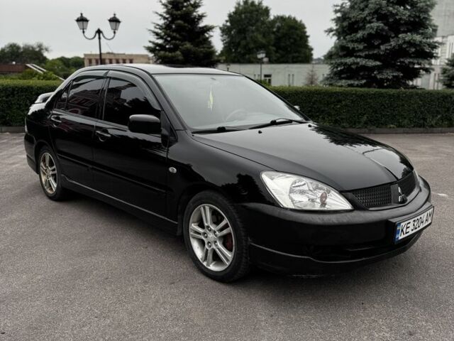 Чорний Міцубісі Lancer, об'ємом двигуна 2 л та пробігом 222 тис. км за 4900 $, фото 2 на Automoto.ua