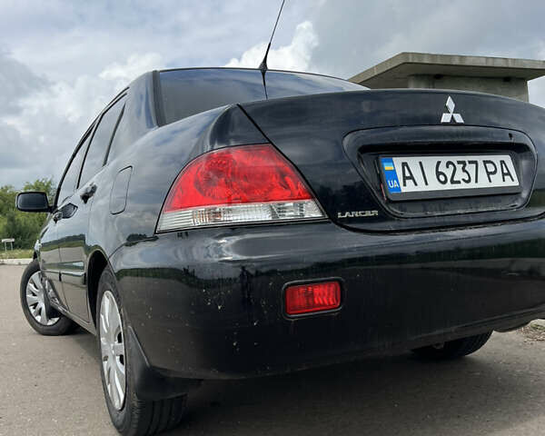 Чорний Міцубісі Lancer, об'ємом двигуна 1.59 л та пробігом 150 тис. км за 5500 $, фото 8 на Automoto.ua