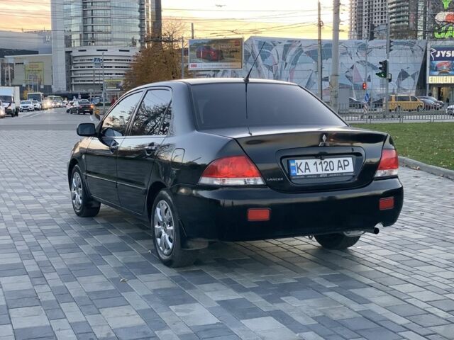 Черный Мицубиси Лансер, объемом двигателя 1.6 л и пробегом 237 тыс. км за 4300 $, фото 7 на Automoto.ua