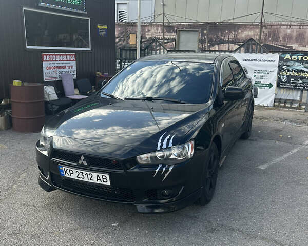 Черный Мицубиси Лансер, объемом двигателя 2 л и пробегом 208 тыс. км за 6500 $, фото 2 на Automoto.ua