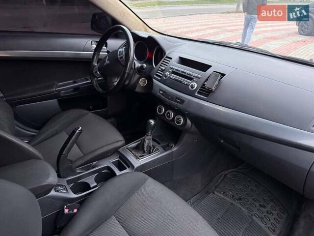 Черный Мицубиси Лансер, объемом двигателя 2 л и пробегом 217 тыс. км за 5500 $, фото 8 на Automoto.ua