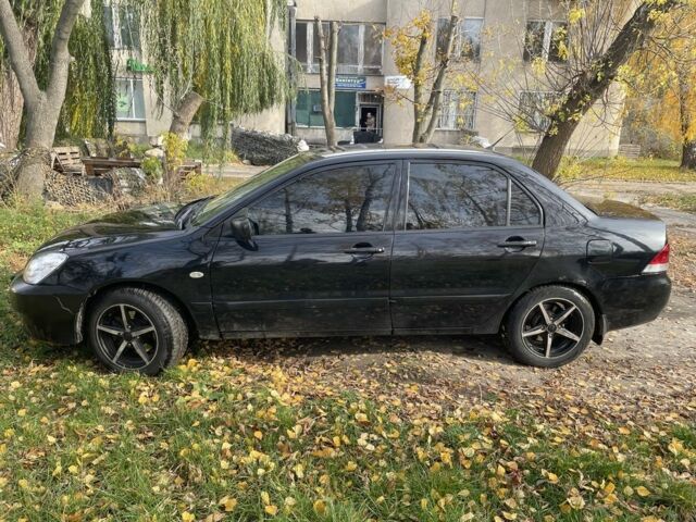 Міцубісі Lancer 2007 у Каневе на Automoto.ua Чорний Міцубісі Lancer, об'ємом двигуна 1.6 л та пробігом 310 тис. км за 4100 $, фото 1 на Automoto.ua
