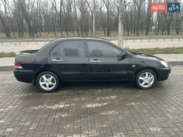 Чорний Міцубісі Lancer, об'ємом двигуна 1.6 л та пробігом 270 тис. км за 4500 $, фото 1 на Automoto.ua