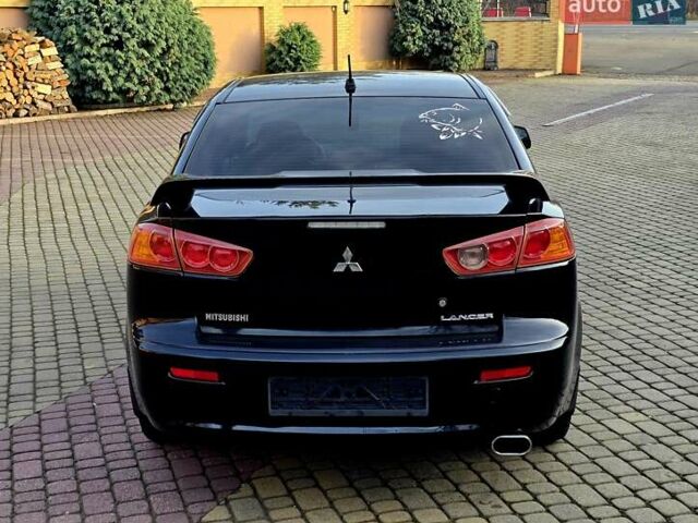 Чорний Міцубісі Lancer, об'ємом двигуна 2 л та пробігом 260 тис. км за 6555 $, фото 18 на Automoto.ua