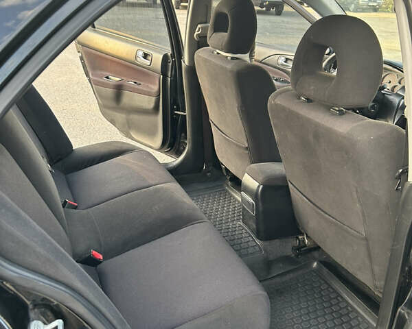 Чорний Міцубісі Lancer, об'ємом двигуна 2 л та пробігом 280 тис. км за 4600 $, фото 40 на Automoto.ua
