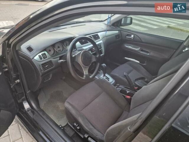 Чорний Міцубісі Lancer, об'ємом двигуна 2 л та пробігом 272 тис. км за 4750 $, фото 15 на Automoto.ua