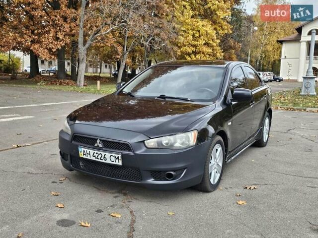 Міцубісі Lancer 2007 у Києві на Automoto.ua Чорний Міцубісі Lancer, об'ємом двигуна 2 л та пробігом 115 тис. км за 5000 $, фото 2 на Automoto.ua