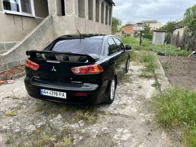 Черный Мицубиси Лансер, объемом двигателя 2 л и пробегом 200 тыс. км за 6900 $, фото 6 на Automoto.ua