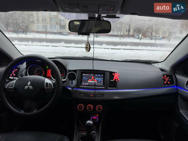 Черный Мицубиси Лансер, объемом двигателя 2 л и пробегом 215 тыс. км за 6600 $, фото 24 на Automoto.ua