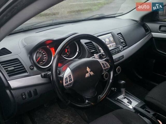 Черный Мицубиси Лансер, объемом двигателя 2 л и пробегом 116 тыс. км за 7200 $, фото 9 на Automoto.ua