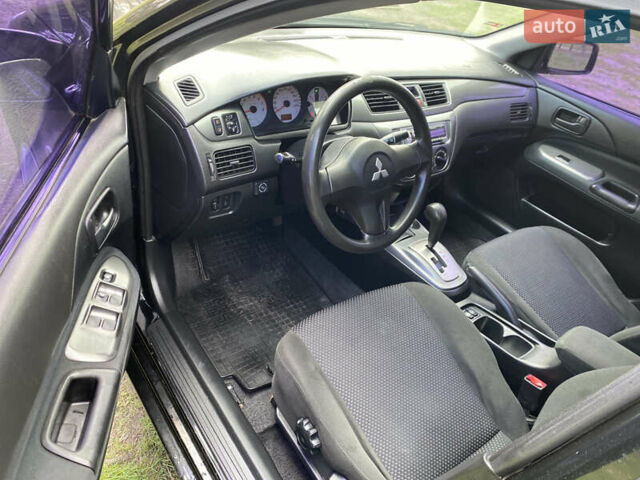 Чорний Міцубісі Lancer, об'ємом двигуна 1.6 л та пробігом 224 тис. км за 4950 $, фото 17 на Automoto.ua