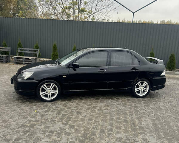 Чорний Міцубісі Lancer, об'ємом двигуна 2 л та пробігом 210 тис. км за 5500 $, фото 1 на Automoto.ua