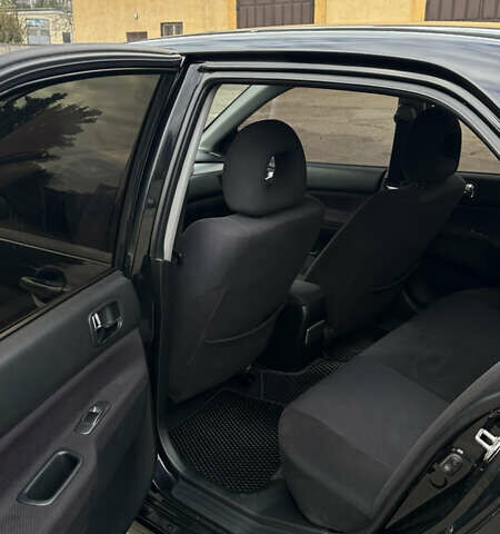 Черный Мицубиси Лансер, объемом двигателя 2 л и пробегом 143 тыс. км за 4999 $, фото 6 на Automoto.ua