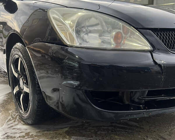 Черный Мицубиси Лансер, объемом двигателя 1.6 л и пробегом 180 тыс. км за 3499 $, фото 1 на Automoto.ua