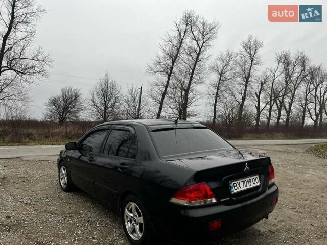 Черный Мицубиси Лансер, объемом двигателя 1.6 л и пробегом 272 тыс. км за 2800 $, фото 10 на Automoto.ua