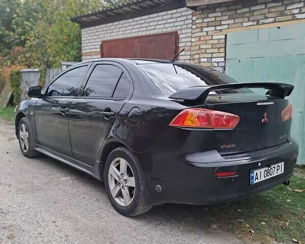 Черный Мицубиси Лансер, объемом двигателя 2 л и пробегом 277 тыс. км за 4650 $, фото 9 на Automoto.ua