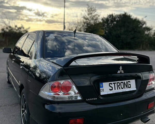 Чорний Міцубісі Lancer, об'ємом двигуна 2 л та пробігом 280 тис. км за 4600 $, фото 27 на Automoto.ua