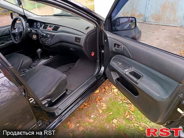 Чорний Міцубісі Lancer, об'ємом двигуна 1.6 л та пробігом 227 тис. км за 4100 $, фото 11 на Automoto.ua